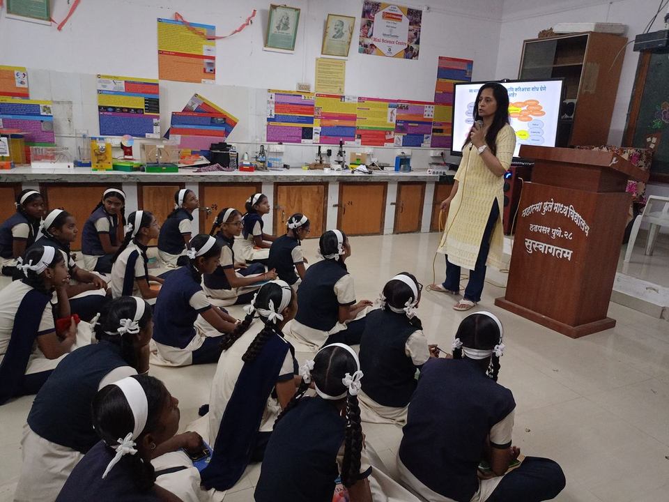 Career mentorship session with schoolgirls in a science classroom